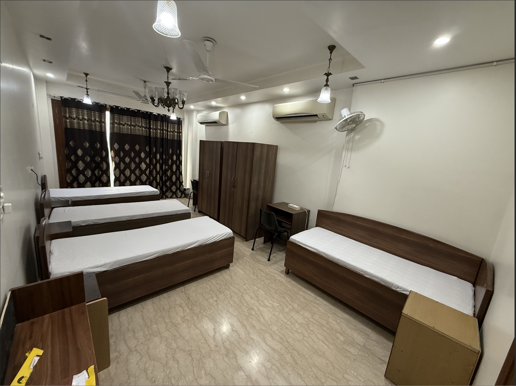 Spacious four bed shared room with storage and study desks